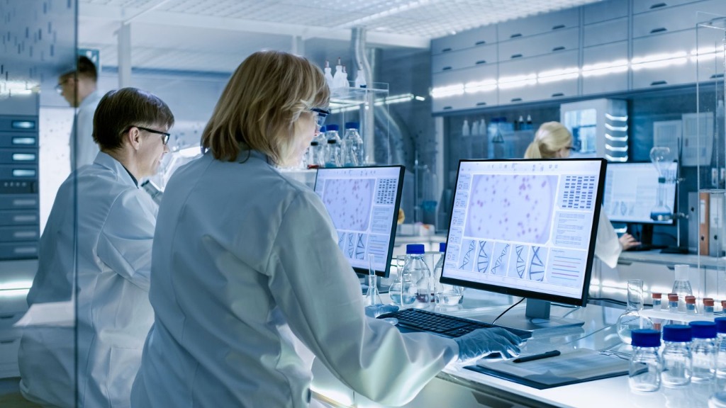 Scientists analyzing lab data